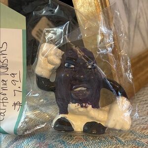 Small vintage California raisins, ceramic figurine